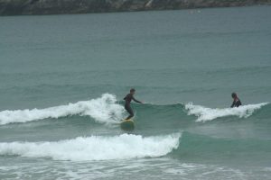 Ollie Bowen surfing on his foamie surfboard