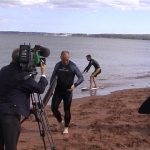 Rob Pittam in front of the camera, while Ben Davis skims behind.